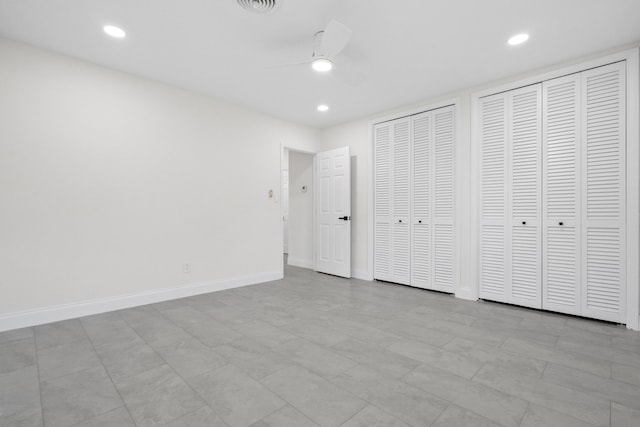 1625 Seaway Dr, Hutchinson Island, FL 34949 - unfurnished bedroom featuring multiple closets, baseboards, recessed lighting, and a ceiling fan