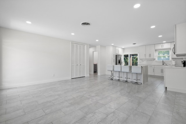 1625 Seaway Dr, Hutchinson Island, FL 34949 - living area with recessed lighting and baseboards