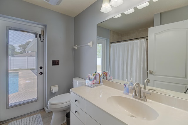 full bathroom featuring vanity, visible vents, toilet, tile patterned floors, and a shower with curtain