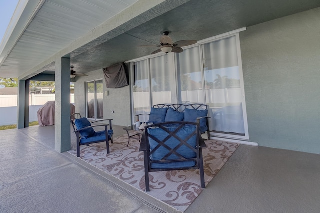view of patio / terrace featuring a ceiling fan and fence