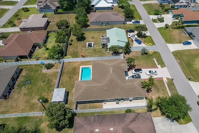 birds eye view of property with a residential view