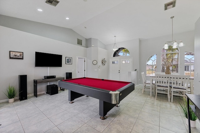 recreation room featuring light tile patterned floors, high vaulted ceiling, and visible vents