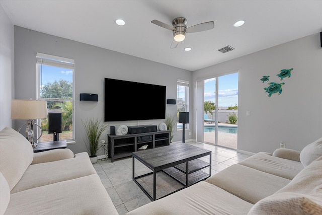 living room with plenty of natural light, recessed lighting, ceiling fan, and visible vents