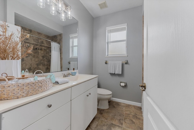 full bath featuring visible vents, vanity, toilet, baseboards, and a tile shower