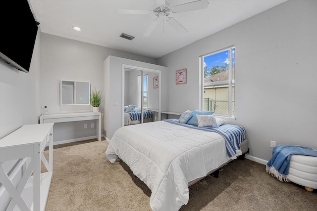 carpeted bedroom with ceiling fan, visible vents, baseboards, a closet, and recessed lighting