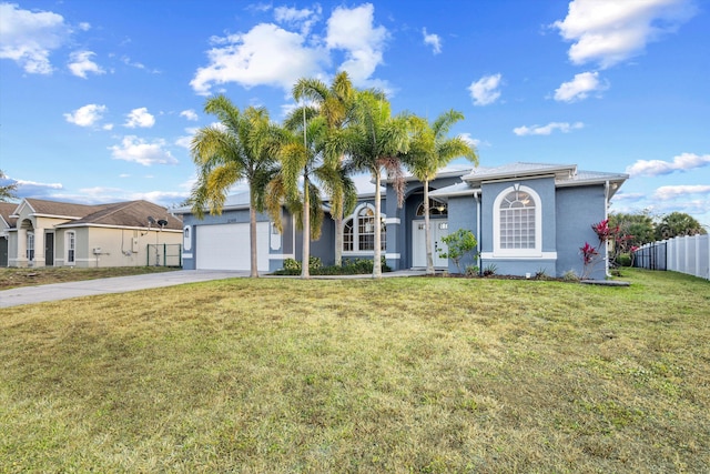 single story home with fence, a garage, stucco siding, a front yard, and concrete driveway
