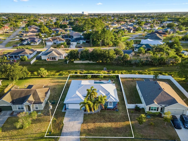 birds eye view of property with a residential view