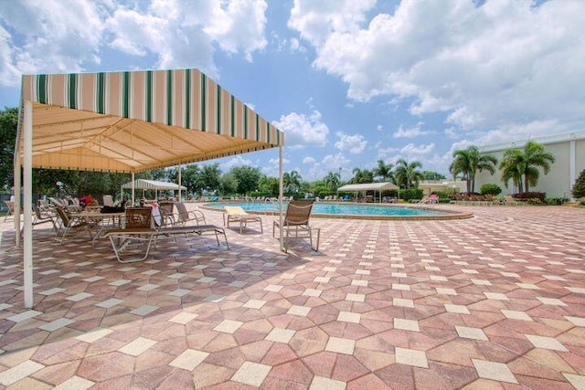 community pool with a patio