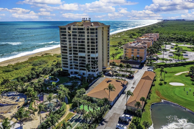 birds eye view of property featuring a water view and a view of the beach