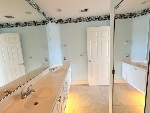 12040 SW Elsinore Dr, Port Saint Lucie, FL 34987 - full bathroom with visible vents, a sink, and double vanity