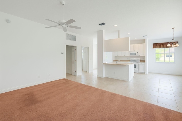 12040 SW Elsinore Dr, Port Saint Lucie, FL 34987 - unfurnished living room with visible vents, baseboards, ceiling fan with notable chandelier, and light tile patterned floors