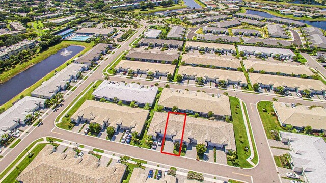 birds eye view of property featuring a residential view and a water view