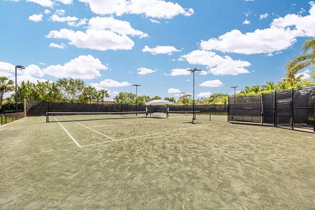 view of sport court with fence
