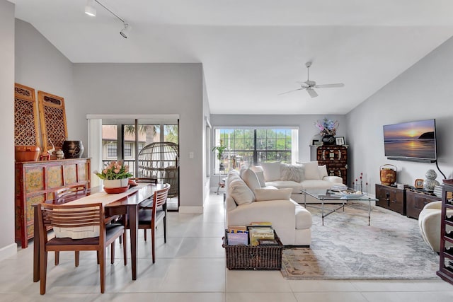 3399 Jog Park Dr, Greenacres, FL 33467 - living area with a ceiling fan, track lighting, baseboards, lofted ceiling, and light tile patterned flooring