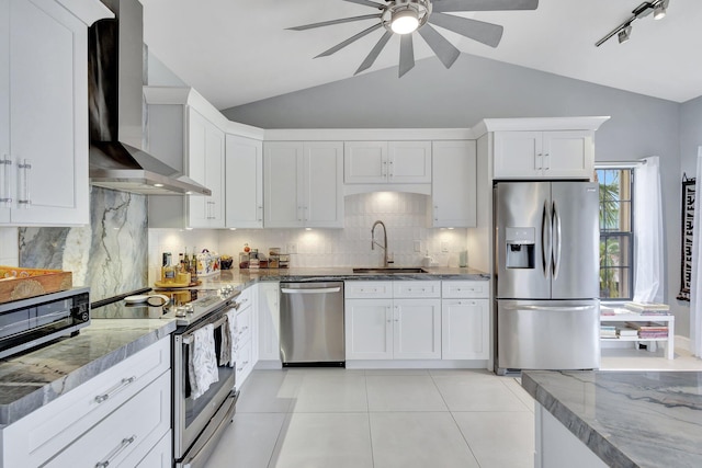 3399 Jog Park Dr, Greenacres, FL 33467 - kitchen with a ceiling fan, appliances with stainless steel finishes, a sink, lofted ceiling, and wall chimney exhaust hood