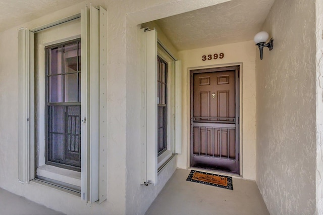 3399 Jog Park Dr, Greenacres, FL 33467 - doorway to property with stucco siding