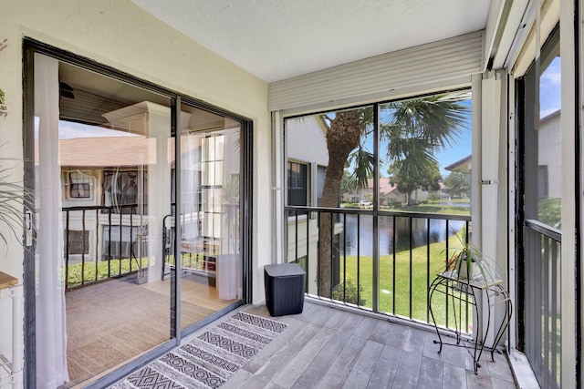 3399 Jog Park Dr, Greenacres, FL 33467 - unfurnished sunroom with a water view