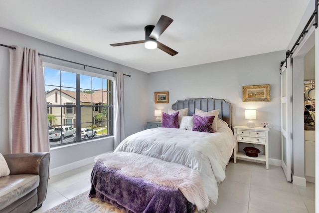 3399 Jog Park Dr, Greenacres, FL 33467 - bedroom with a ceiling fan, baseboards, a barn door, and light tile patterned floors