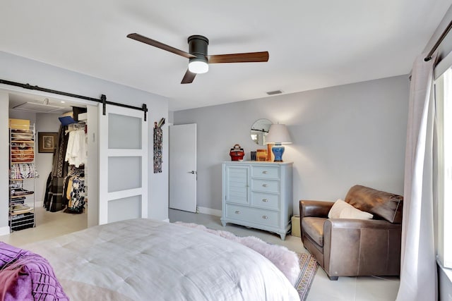 3399 Jog Park Dr, Greenacres, FL 33467 - bedroom with a ceiling fan, visible vents, and a barn door