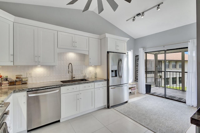 3399 Jog Park Dr, Greenacres, FL 33467 - kitchen with a sink, appliances with stainless steel finishes, tasteful backsplash, and lofted ceiling
