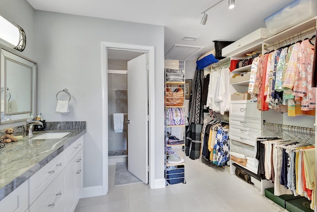 3399 Jog Park Dr, Greenacres, FL 33467 - interior space with light tile patterned floors, a sink, and attic access