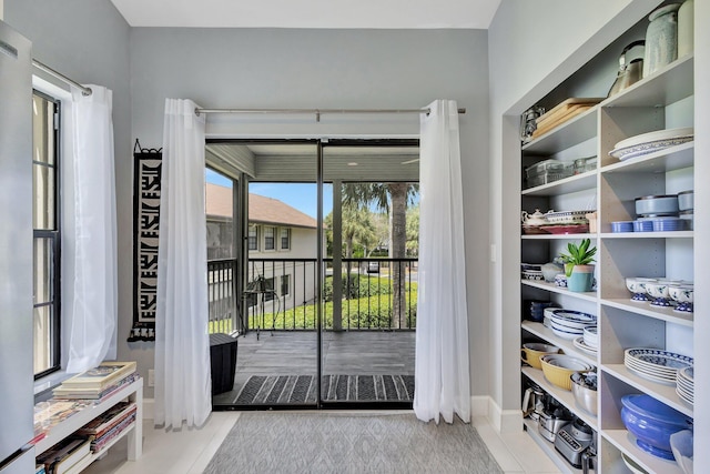 3399 Jog Park Dr, Greenacres, FL 33467 - doorway to outside featuring tile patterned flooring