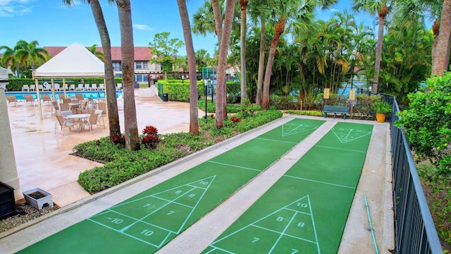 3399 Jog Park Dr, Greenacres, FL 33467 - view of property's community with shuffleboard, a swimming pool, and fence