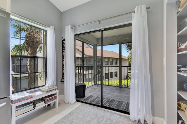 3399 Jog Park Dr, Greenacres, FL 33467 - entryway with plenty of natural light, baseboards, and tile patterned flooring