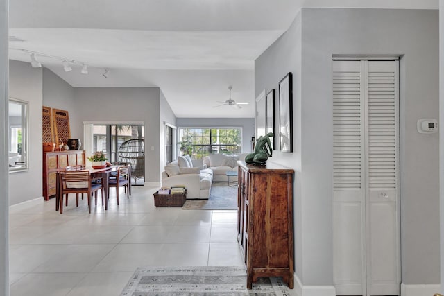 3399 Jog Park Dr, Greenacres, FL 33467 - corridor featuring light tile patterned floors, track lighting, and baseboards