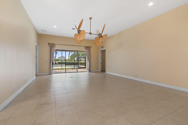 10765 Pisa Rd, Wellington, FL 33414 - spare room featuring baseboards, light tile patterned floors, and recessed lighting