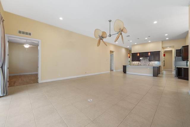 10765 Pisa Rd, Wellington, FL 33414 - unfurnished living room featuring visible vents, light tile patterned flooring, baseboards, ceiling fan, and recessed lighting