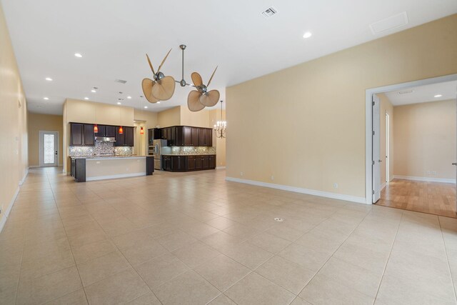 10765 Pisa Rd, Wellington, FL 33414 - unfurnished living room with recessed lighting, visible vents, and light tile patterned flooring