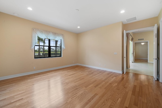 10765 Pisa Rd, Wellington, FL 33414 - spare room with visible vents, recessed lighting, light wood-style floors, and baseboards