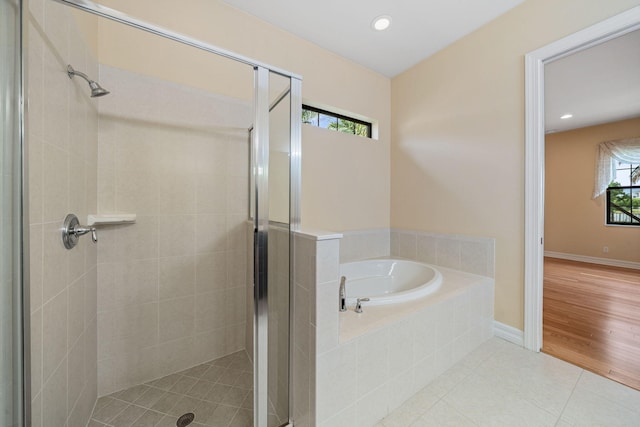 10765 Pisa Rd, Wellington, FL 33414 - bathroom with a stall shower, tile patterned floors, a garden tub, and recessed lighting