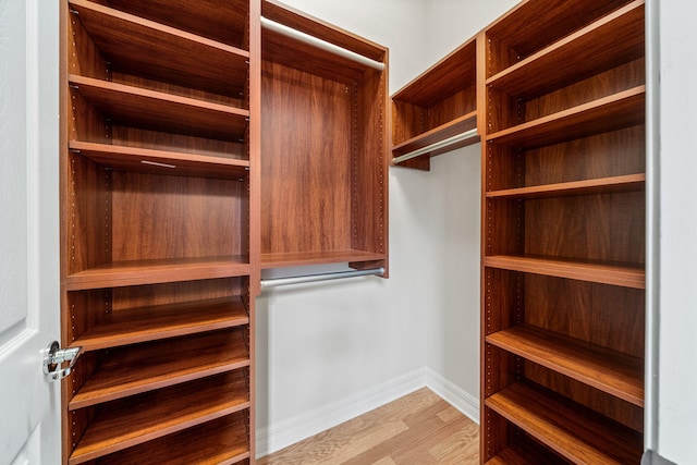 10765 Pisa Rd, Wellington, FL 33414 - spacious closet featuring wood finished floors