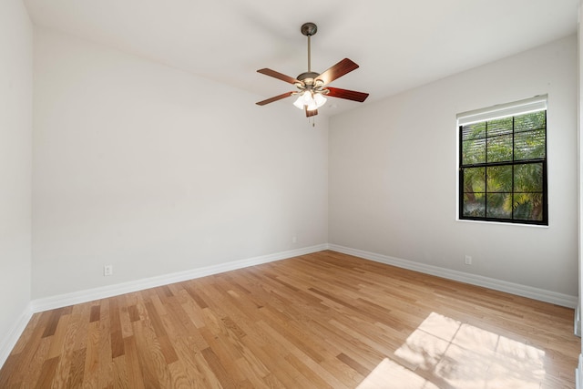 10765 Pisa Rd, Wellington, FL 33414 - spare room with baseboards, a ceiling fan, and light wood-style flooring