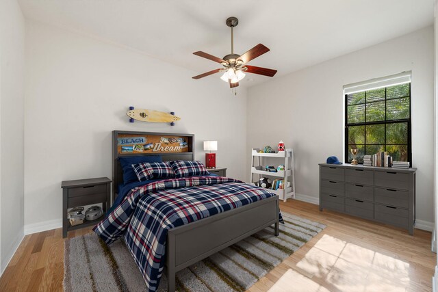 10765 Pisa Rd, Wellington, FL 33414 - bedroom featuring baseboards, ceiling fan, and wood finished floors