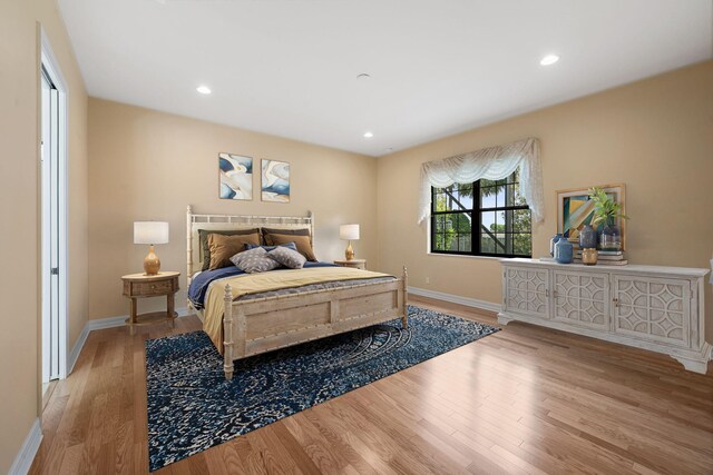 10765 Pisa Rd, Wellington, FL 33414 - bedroom featuring baseboards, recessed lighting, and light wood-style flooring