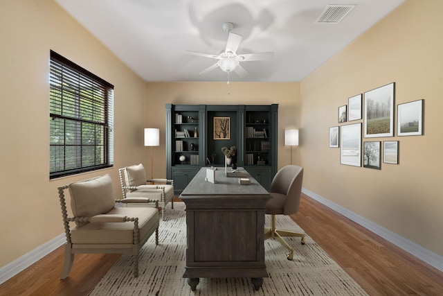 10765 Pisa Rd, Wellington, FL 33414 - office area featuring baseboards, ceiling fan, visible vents, and wood finished floors