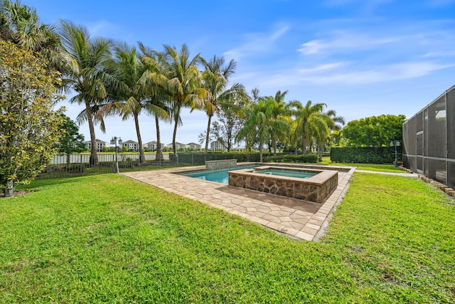 10765 Pisa Rd, Wellington, FL 33414 - view of swimming pool with a lawn, an in ground hot tub, fence, and a fenced in pool