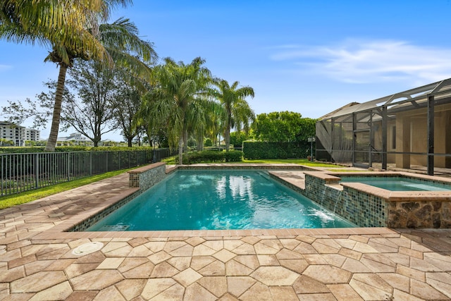 10765 Pisa Rd, Wellington, FL 33414 - view of pool featuring a patio, a lanai, fence, and a pool with connected hot tub