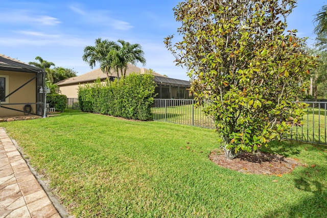 10765 Pisa Rd, Wellington, FL 33414 - view of yard featuring a fenced backyard and a lanai