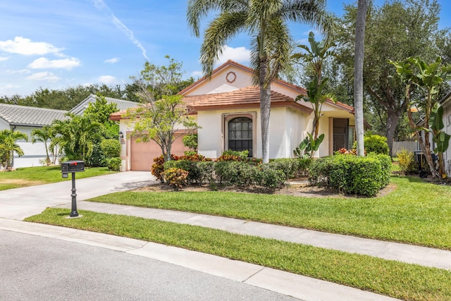 10056 Lexington Cir N, Boynton Beach, FL 33436 - mediterranean / spanish-style house with an attached garage, a tile roof, stucco siding, a front yard, and concrete driveway