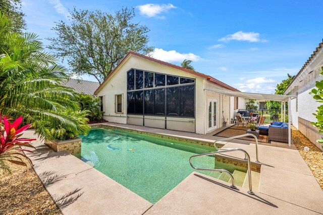 10056 Lexington Cir N, Boynton Beach, FL 33436 - pool featuring french doors, a patio, and an outdoor hangout area