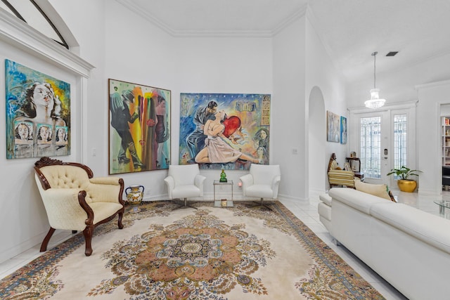 10056 Lexington Cir N, Boynton Beach, FL 33436 - living room featuring crown molding, arched walkways, and tile patterned floors