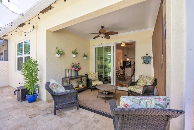view of patio / terrace with an outdoor living space and a ceiling fan