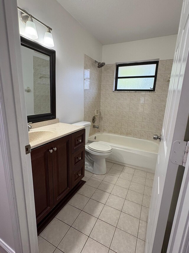 full bath with tile patterned flooring, shower / bathtub combination, toilet, and vanity
