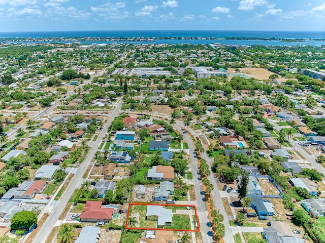 bird's eye view with a water view and a residential view