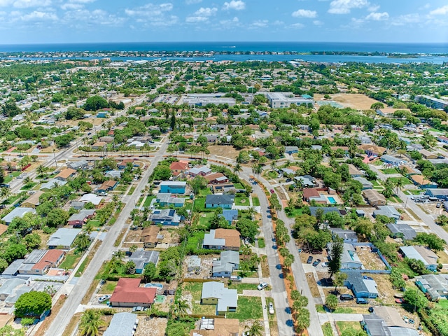 bird's eye view with a water view and a residential view