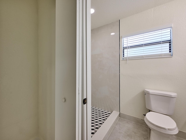 full bath with a walk in shower, toilet, and tile patterned flooring